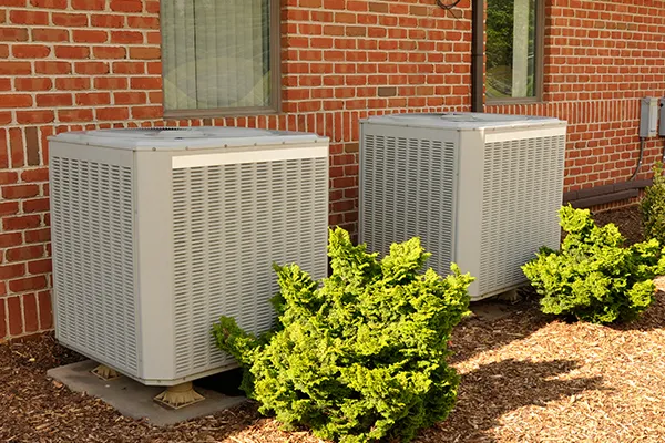 An image showing a air condition system on the side of an office building